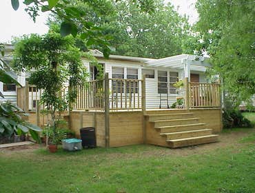 Baker Custom Deck with Pergola This Custom Deck was built over an old existing concrete patio. We even covered over the old concrete steps! This deck w