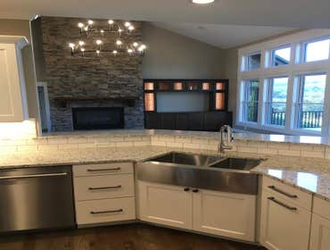 Photos by Thomas Elliott #1 2100 sf home with partially finished pre-cast concrete basement. This home has wood flooring, custom woodwork, tile and cab