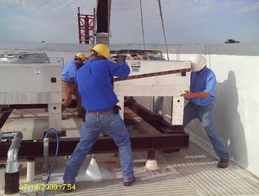 Dry Cooler Installation New dry Cooler on the roof of a comercial building