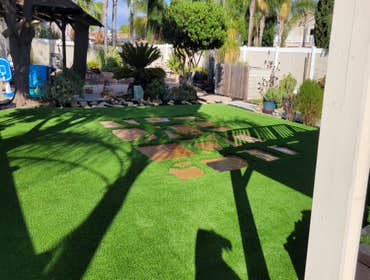 Photos by Jz Synthetic Products #3 Flagstone, with beautiful turf all around..
A great flagstone install with some high quality turf to add to its beau