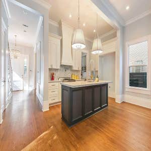 7631 Hampson St. Stunning conversion from a single shotgun to a 2500 sq. ft. camelback located off of St. Charles