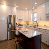 Always Sunny This custom kitchen is warm and inviting. The paint color is a soft hue of yellow making the space feel perpetually cheery and sunlit. T