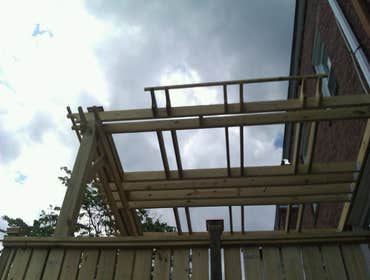 Photo(s) from Laur Moor Construction Two decks and a tiled kitchen floor