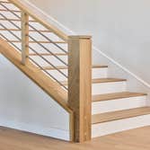 Photos by San Clemente Woodworking #1 Stainless Steel horizontal rods with our custom shadow posts. Clean lines and modern design.