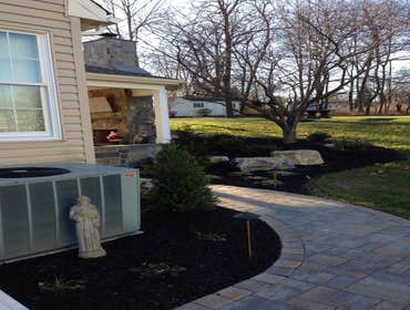 Outdoor kitchen/ sitting area This was a outdoor pavillion on the back of the homeowners house with a grilling area a fire place and outdoor sitting ar