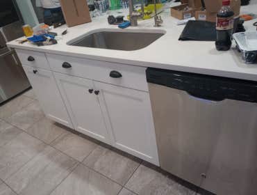 Kitchen cabinet refinish Cabinets went from black to these beautiful cupboards. This project took only a few days and the owner loves it!!