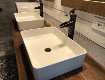 Photos by Elite Building and Remodeling #1 Rustic Bathroom