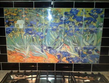 Photos by Cornerstone & Son Construction LLC #8 Black subway tile with mural. Stone subway tile with border accent on bottom.