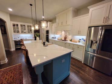 Photos by Trublue of Allen #32 The doors and drawers were replaced by new ones shaker style with slow closing. New countertop in Calacatta Paris, new l