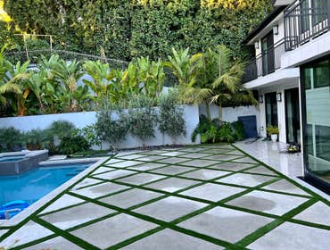 Photos by Ajp Landscape Inc #1 Custom Geometric Concrete with Artificial Turf Inlay
This project features a modern hardscape design with large concret