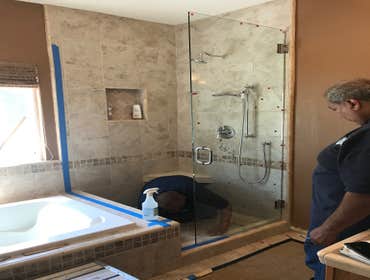 Photos by Griffin Tile & Marble Co #1 Master bath remodel. Remove PVC shower insert , remove separating wall , install new tile shower matching the til