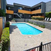 Pool and Courtyard Renovation Pool Replaster, Pool Equipment Replacement, Paver Installation, Fence Repairs, and BBQ Replacement