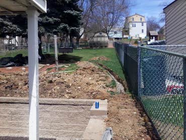Photo(s) from Hollis Contracting From tearing down the wall to rebuilding the wall, to pouring and finishing the patio along with a french drain around