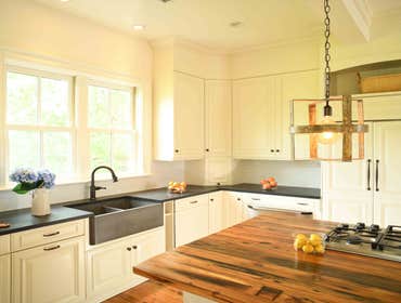 Photos by CRM-CM #2 Replace hardwoods throughout. Complete renovation to kitchen and powder room. Restore patio