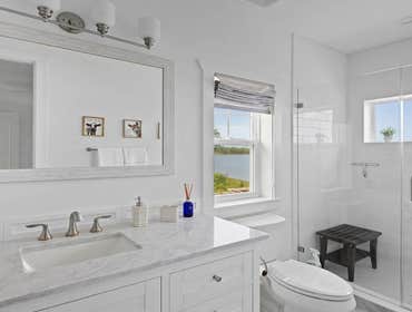 Bells River Residence Nestled in the serene Waterman’s Bluff in Yulee, FL, this exquisite home offers 3,046 sq ft of living space, expanding to a total