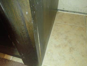 Cabinet repair after water damage Cabinets damage by water, repaired them than refinished all so they looked the same.