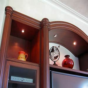 P S Woodworking Project Custom built-in arched Cherry media center with fluted columns and speakers integrated into doors & drawer fronts. Designed...