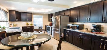 Oceanside Kitchen Remodel Espresso Shaker cabinets. granite counter tops. Tile on floor.