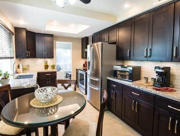 Oceanside Kitchen Remodel Espresso Shaker cabinets. granite counter tops. Tile on floor.
