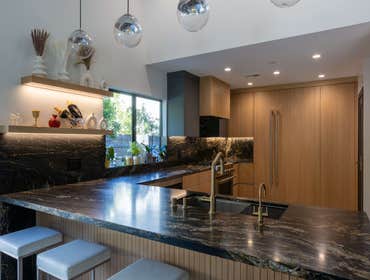 Lime Kitchen Remodel Explore our recent kitchen remodel showcasing elegant marble countertops, modern cabinetry, and stylish lighting fixtures, creatin