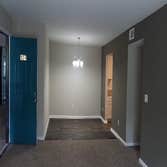 Photos by Combined Construction Services, Inc #1 Interior multi-family renovation including cabinets, countertops, flooring, paint, trim, and appliance