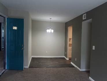Photos by Combined Construction Services, Inc #1 Interior multi-family renovation including cabinets, countertops, flooring, paint, trim, and appliance