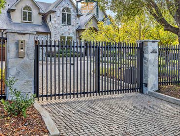Dual Swing Gate & Fence Installation in Los Altos Hills, CA This stunning driveway entrance was a full transformation! We built everything from the gro