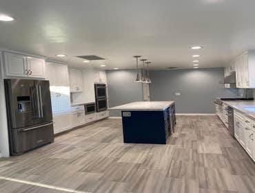 Photos by Sviri Construction Inc #5 Custom kitchen with custom cabinets, tile flooring, new island, pendant lights, new appliances and stunning quartz 
