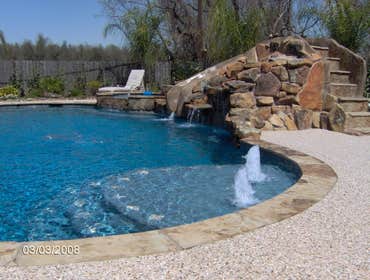 magnolia texas ,the woodlands ,baytown pool with rock waterfall ,hot tub,beach entry