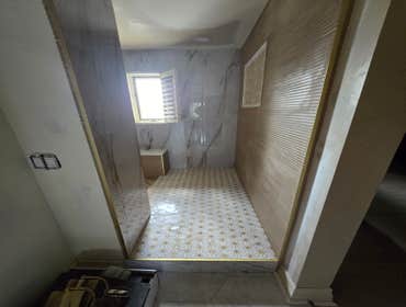 Photos by MC ALISTER TILE #1 5 showers total, was hired after another handyman did not water proof correctly, fixed all water proofing and installed 