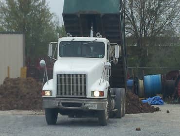 art jr dumping dirt at yard