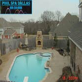 CUSTOM POOL/SPA MCKINNEY THIS WAS A UNIQUE POOL WITH A TANNING LEDGE THAT EN COMPOSED THE SPA, IT WAS A DIVING POOL AND HAD TRAVERTINE COPING AND SALT 