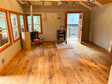 Index Cabin This Cabin in Index suffered a tree strike, which led the homeowners to a full kitchen remodel, new paint/flooring, and new ramp decking an