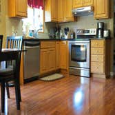 A family's living room and kitchen installed with laminate This project started out with us removing the old existing carpet in the living room and old