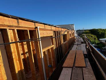 Photos by Santiago's Bay Builders Inc #1 Remodeling half of the building