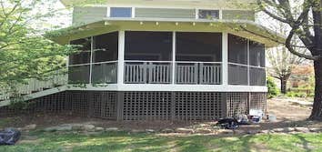 A new exposed roof framing for an existing back deck The existing back deck faced the afternoon sun. the homeowners wanted to screen the porch in as w