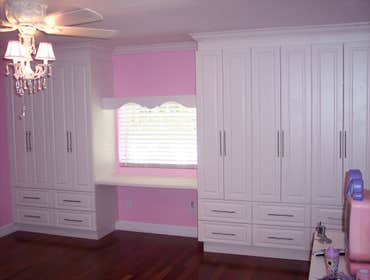 Heather Mikes closets. We turn this huge 24 x 20 play room into a beautiful bedroom with this combo closet-organizer-computer desk. We use white melami