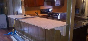 Music Modern Design Projects Porch and granite kitchen tops with a bar.