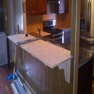 Music Modern Design Projects Porch and granite kitchen tops with a bar.