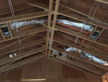 Photos by All Weather Heating and Air Conditioning Two complete HVAC systems including ducting, to be installed in two phases; pictures shown are from 