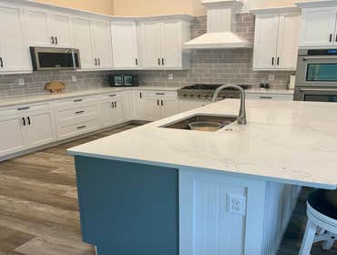 White Shaker Kitchen Renovation Renovation of an existing kitchen using white shaker cabinets and quartz countertops