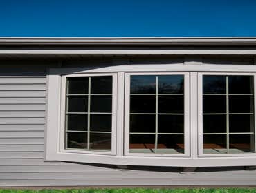 Des Plaines, IL 60018 This project included a kitchen remodel, addition remodel with new bow window, wainscoting and new siding