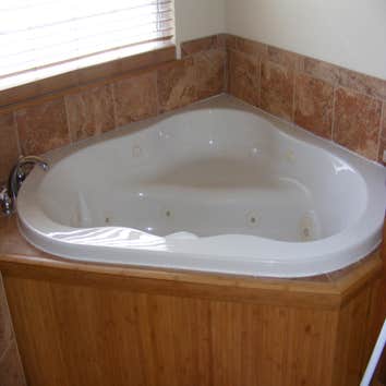 large tub wraped with bamboo
