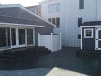 Rear yard with twin sheds and steps