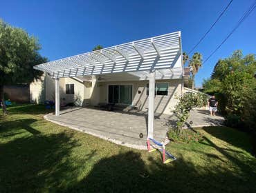 Photos by Eco Design Pro #8 Wood overhung with part solid roof and part Trellis. Pavers floor. Gravel outside.
