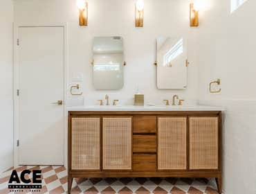 Desert Luxe- Bathroom Remodel This bathroom remodel blends classic elegance with a touch of bold style. The all-white walk-in shower features a built-i