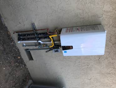 Photos by All HVAC and General Construction #1 New outdoor tankless water heater