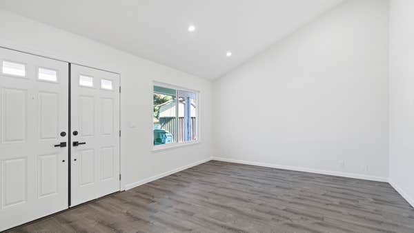Room remodel with new flooring and lighting
