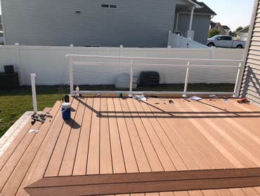 Backyard remodel This beautiful back yard was remodeled with a new lovely deck of high quality composite deck boards, a wrap around stamped and colored