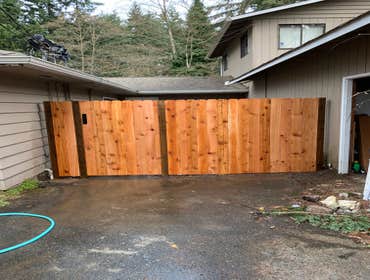 Photos by Lifetime Construction #1 This was a 13ft long 6ft tall cedar privacy fence with a 40” gate that a customer had wanted built to provide a tena